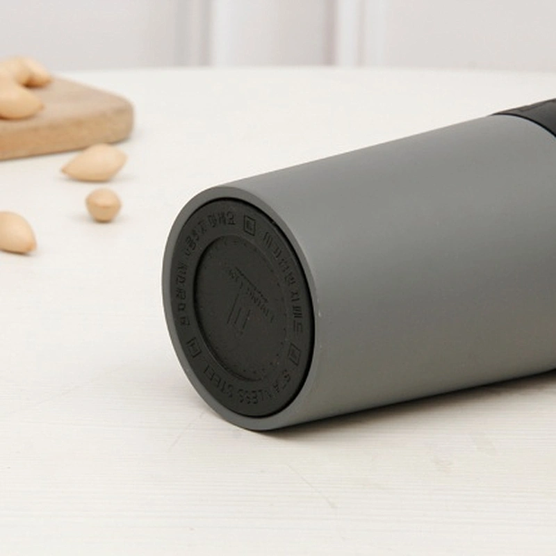 600 ML vacuum insulated thermal mug with 360 degree push button lid , mug body with silicone band